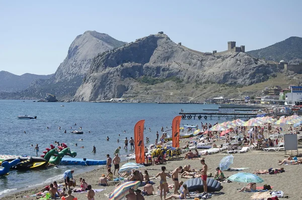 Tourists on the beach in Sudak