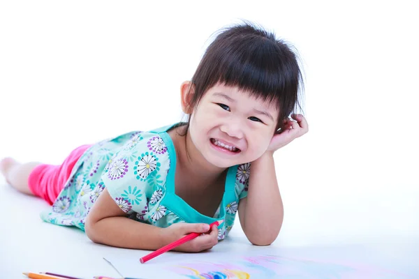 Child lie on the floor drawing on paper and smiling. On white Stock Photo