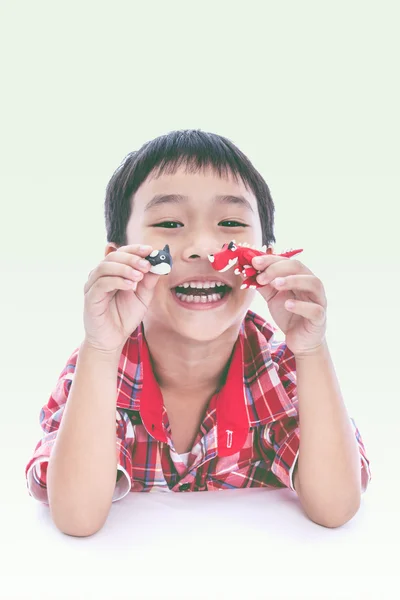 Child show his works from clay, on white background. — Stock Photo, Image