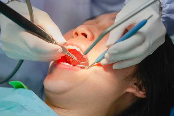 Attractive Woman Undergoing Dental Treatment Specialist Wearing Rubber Gloves Doing — Stock Photo, Image