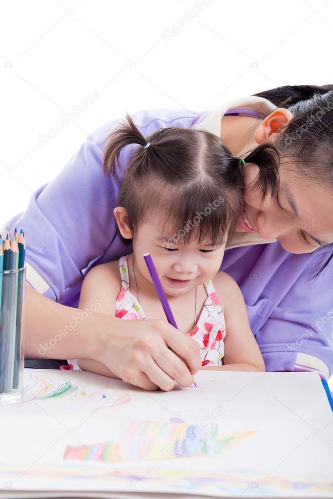 Mother with child girl draw and paint together
