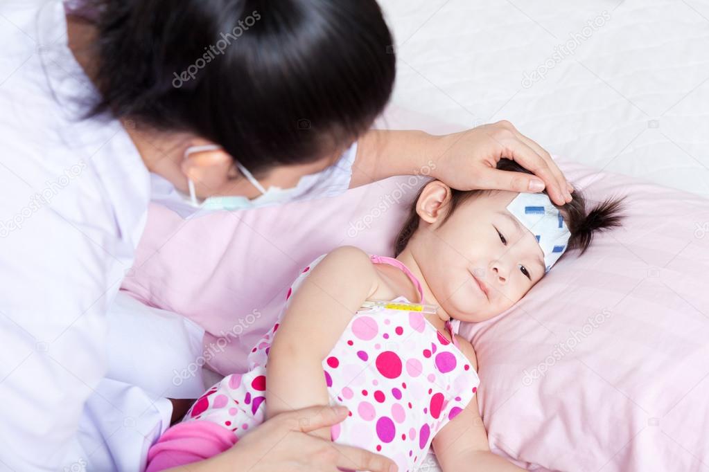 Sick little girl nursed by a pediatrician