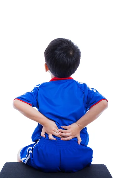 Ból pleców. Dziecko, trąc mięśni jego dolnej części pleców — Zdjęcie stockowe