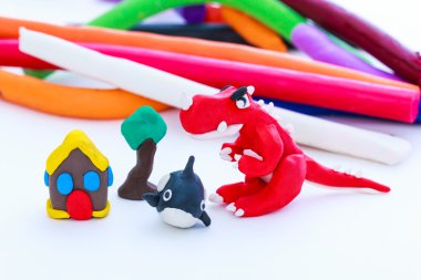 Creative dinosaur, whale, house and tree clay model, on white background