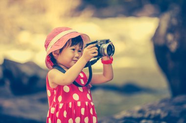 Asian girl photographer with professional digital camera