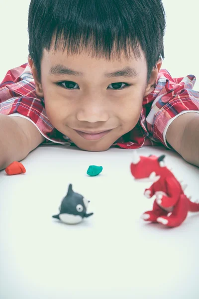 Child show his works from clay, on white. Strengthen the imagination of child. — Stock Photo, Image