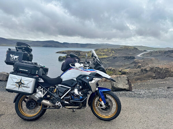 Iceland June 24, 2025: BMW R 1250 GS in front of a blooming lupine field in Iceland