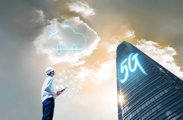 5G letters are on tall buildings, Concept of future technology 5G network wireless network that will control everything through electronic devices or have a short name called Internet of Things or IOT