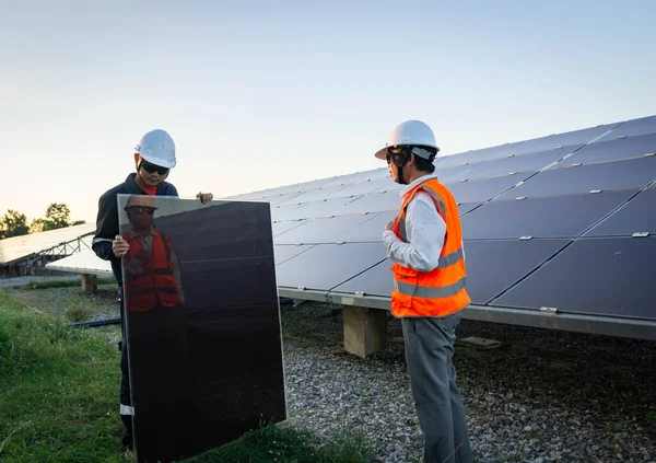 Technician is lifting the solar cell to replace the damaged one, Alternative energy to conserve the world\'s energy, Photovoltaic module idea for clean energy production.