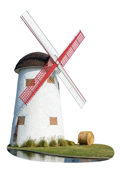 Windmill and straw in the lawn — Stock Photo, Image