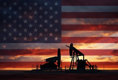 Gün batımında Amerikan ulusal bayrağıyla kırsal kesimde petrol arama çalışmaları