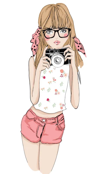 Fille avec appareil photo et lunettes — Image vectorielle