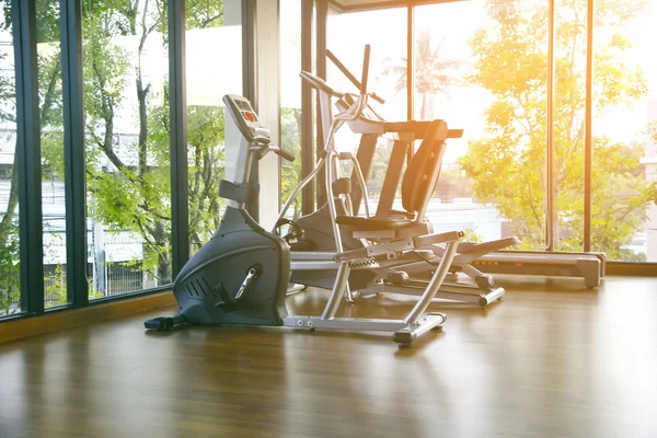 Stock Photo Gym with windows and running machines with wooden floor — Stock Photo, Image