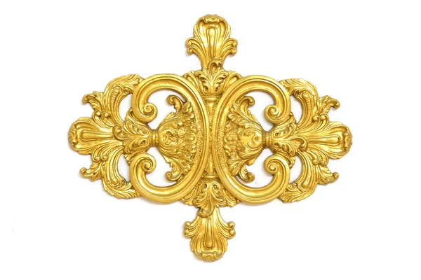 Van een oude gouden ornament op een witte achtergrond — Stockfoto