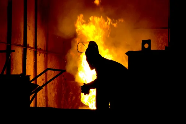 Hard work in a foundry, melting iron — Stock Photo, Image