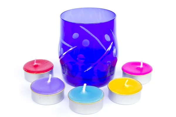 Colorful glass with different candles on background. — Stock Photo, Image