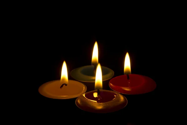 Burning tealights in the dark — Stock Photo, Image