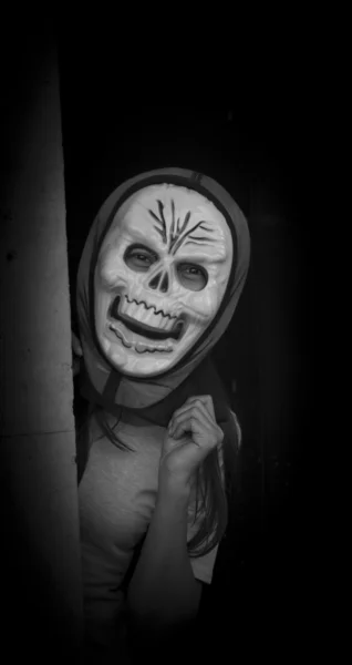 Toned portrait of a senior with a devil mask — Stock Photo, Image