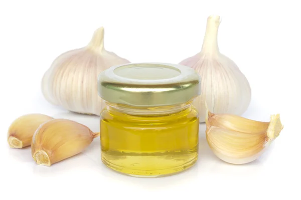 Bolbos de alho e jarro de mel como alimentação saudável — Fotografia de Stock