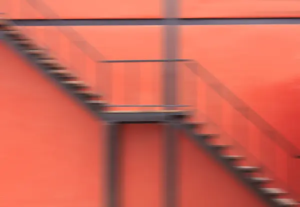 Red wall and red staircase — Stock Photo, Image