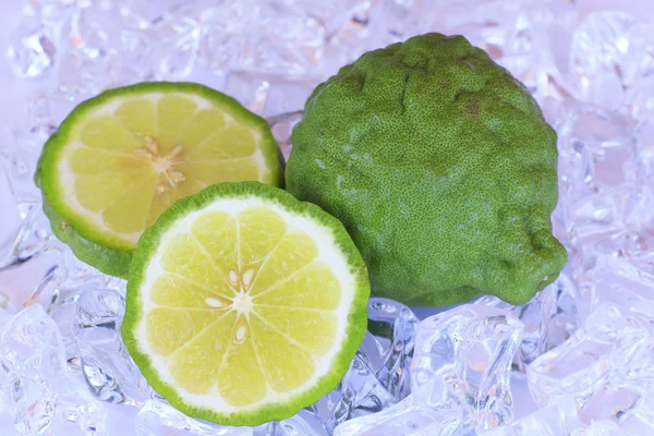 Kaffir limes on ice  - Stock Image — Stock Photo, Image