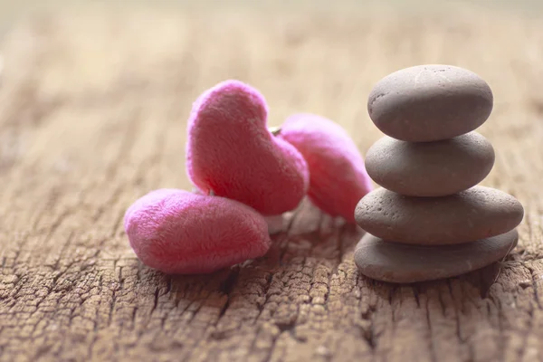 Zen stones and violet Heart on wooden - Stock Image — Stock Photo, Image