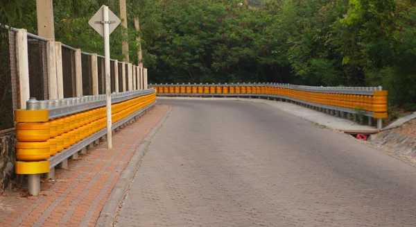 Curb separated asphalt road - Stock Image — Stock Photo, Image