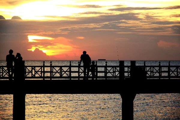 Stock Photo - People silhouettes on the sunset — Stock Photo, Image