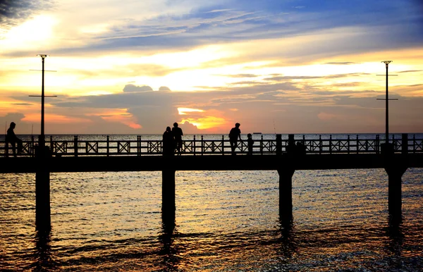 Stock Photo - People silhouettes on the sunset — Stock Photo, Image