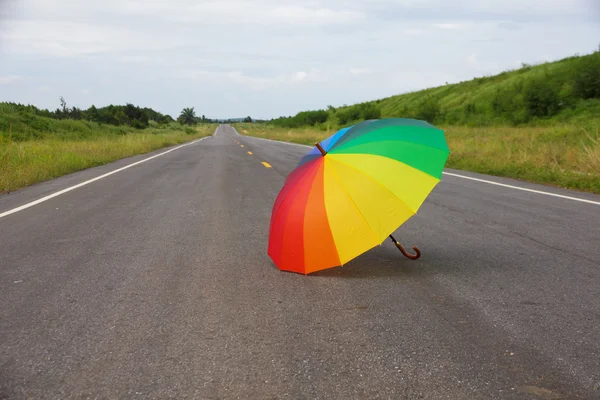 Stock Photo - Colorful umbrella on the road — Stock Photo, Image