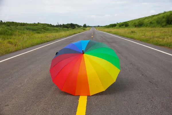 Stock Photo - Colorful umbrella on the road — Stock Photo, Image