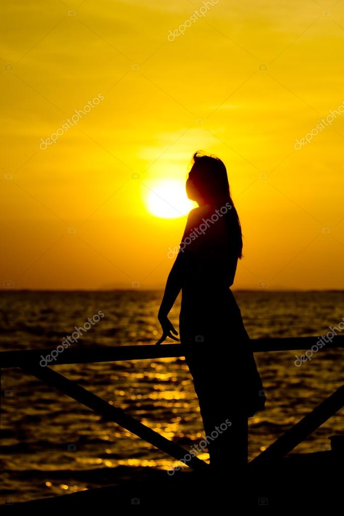 Profile of a Sad Young Woman Silhouette in Swimsuit Stock Image