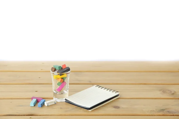 Stock Photo closeup of chalk on wooden table background — Stock Photo, Image