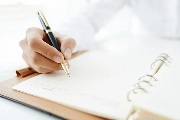 Male hand making notes — Stock Photo, Image