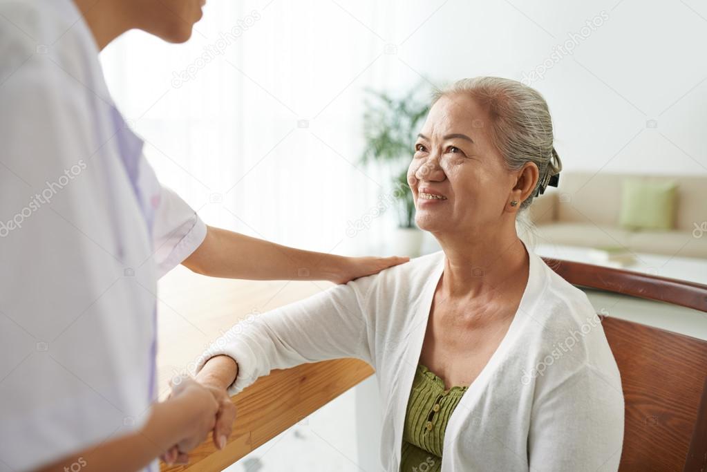 woman looking at her doctor