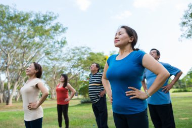 people practicing breathing exercise