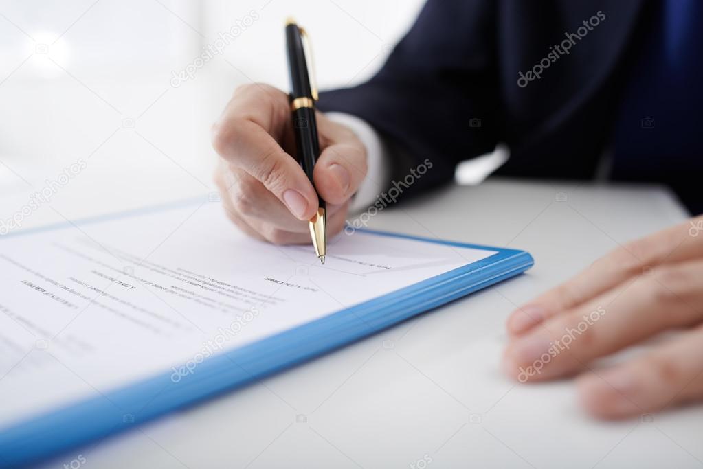 Business person filling contract
