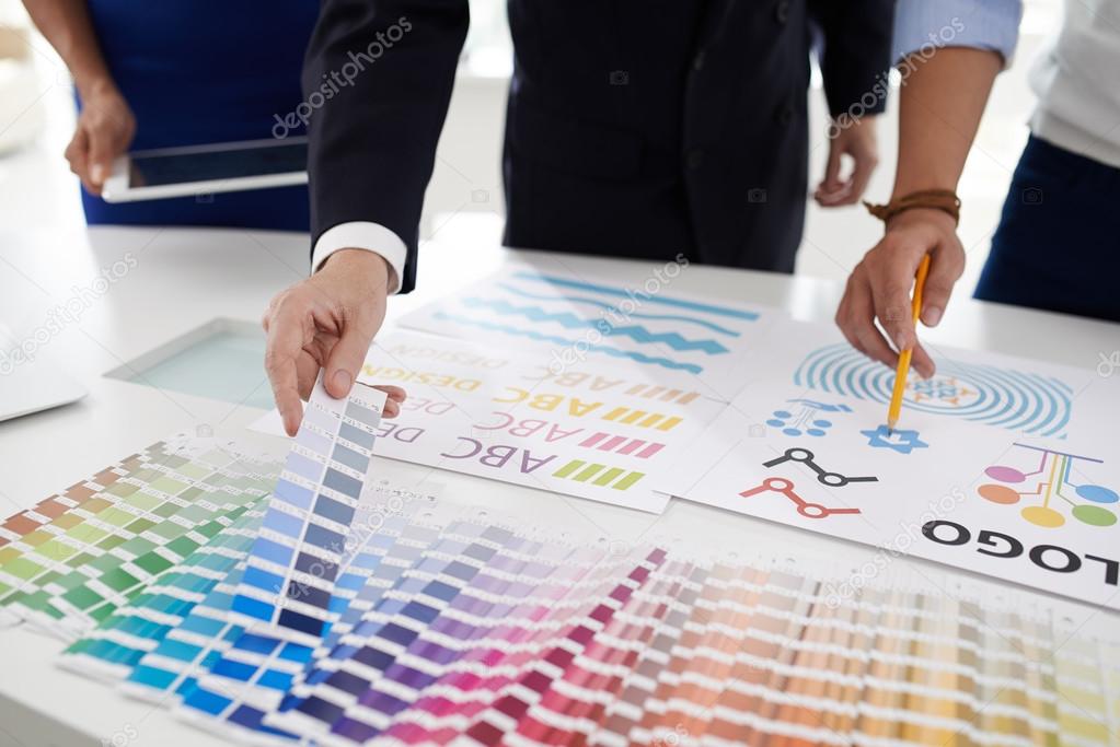 Design team choosing color palette for logo of the company. Choosing color palette