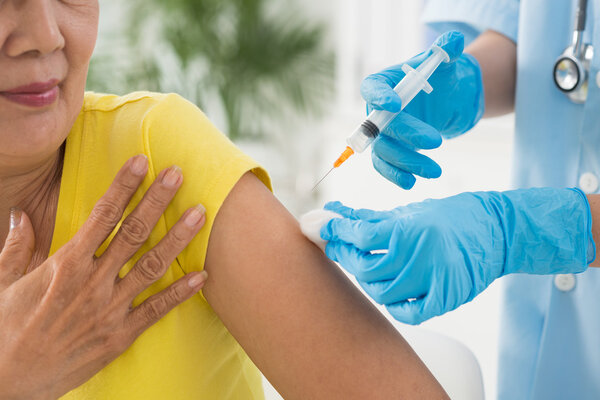 Doctor giving injection