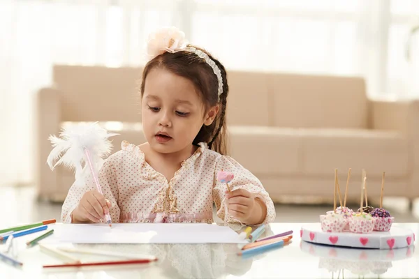 Girl eating sweets — Stock Photo, Image