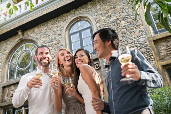 Cocktail party guests with glasses — Stock Photo, Image
