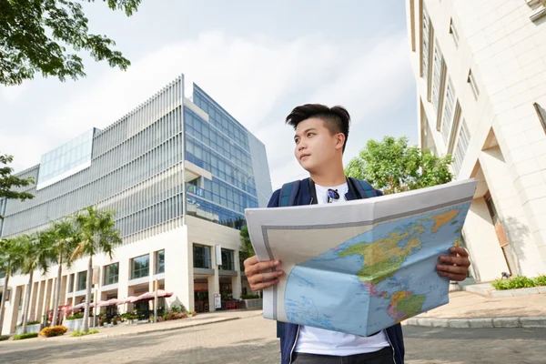 Asian man with a map — Stock Photo, Image