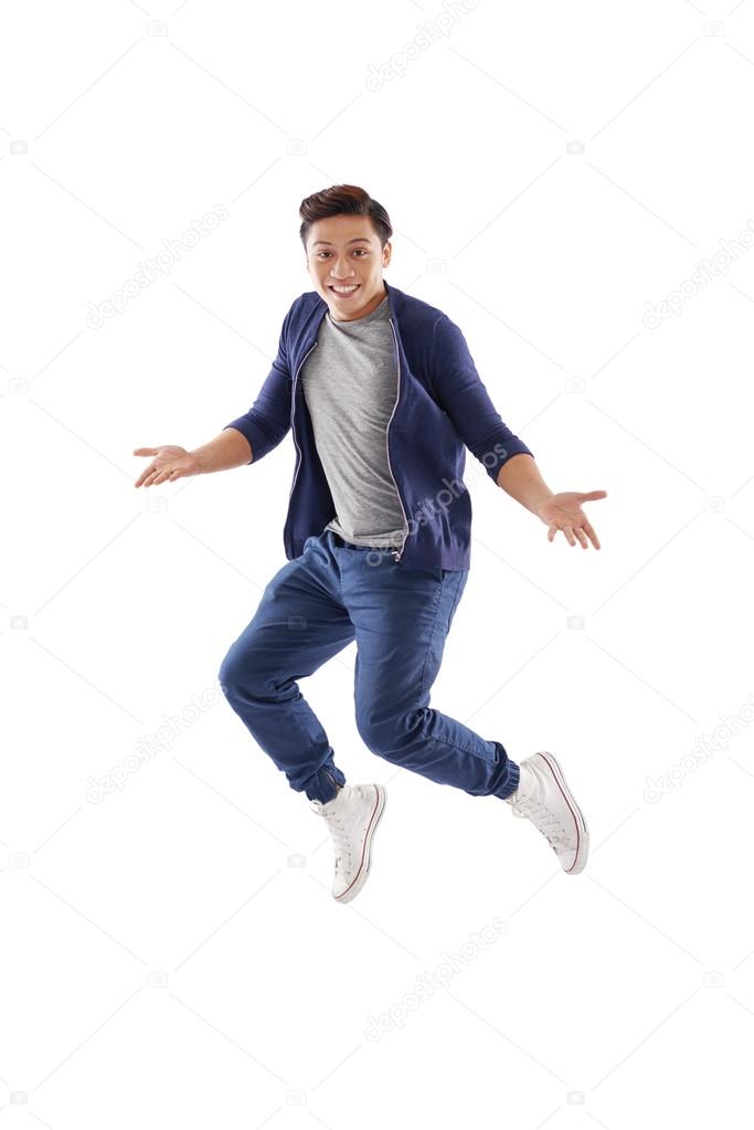 Surprised young man jumping