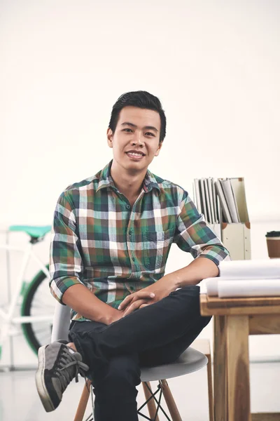 Student boy sitting near table — Stock Photo, Image