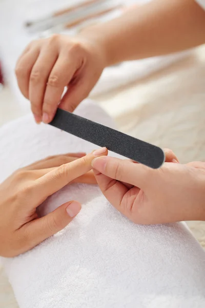 Master filing nails — Stock Photo, Image