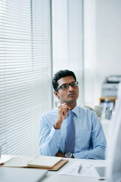 Comtemplaiting businessman in office — Stock Photo, Image