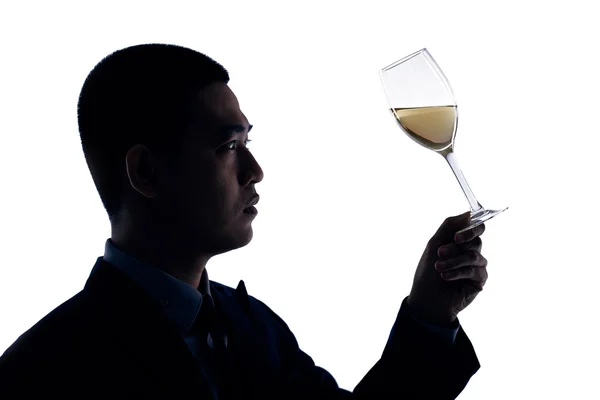 Business person looking at glass of wine — Stock Photo, Image