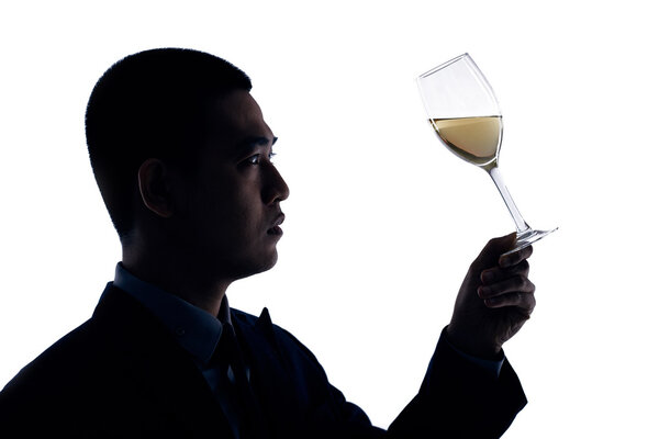 business person looking at glass of wine