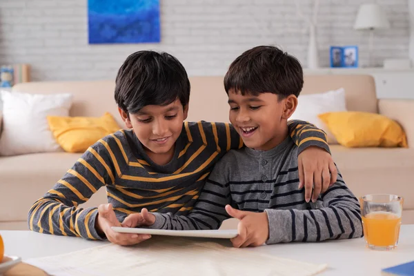 Children watching something on digital tablet — Stock Photo, Image