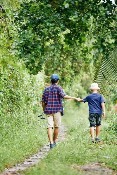 Man Fishing Rod Holding Hand His Little Son Walking Path — Stock Photo, Image